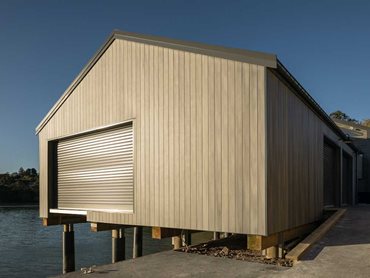 The boat shed features Innoclad composite timber cladding in a stunning vertical orientation 