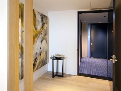 Internal View of Modern House Interior With Abstract Artwork and Timber Flooring 