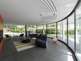 Residential interiors and exteriors from bent and curved glass